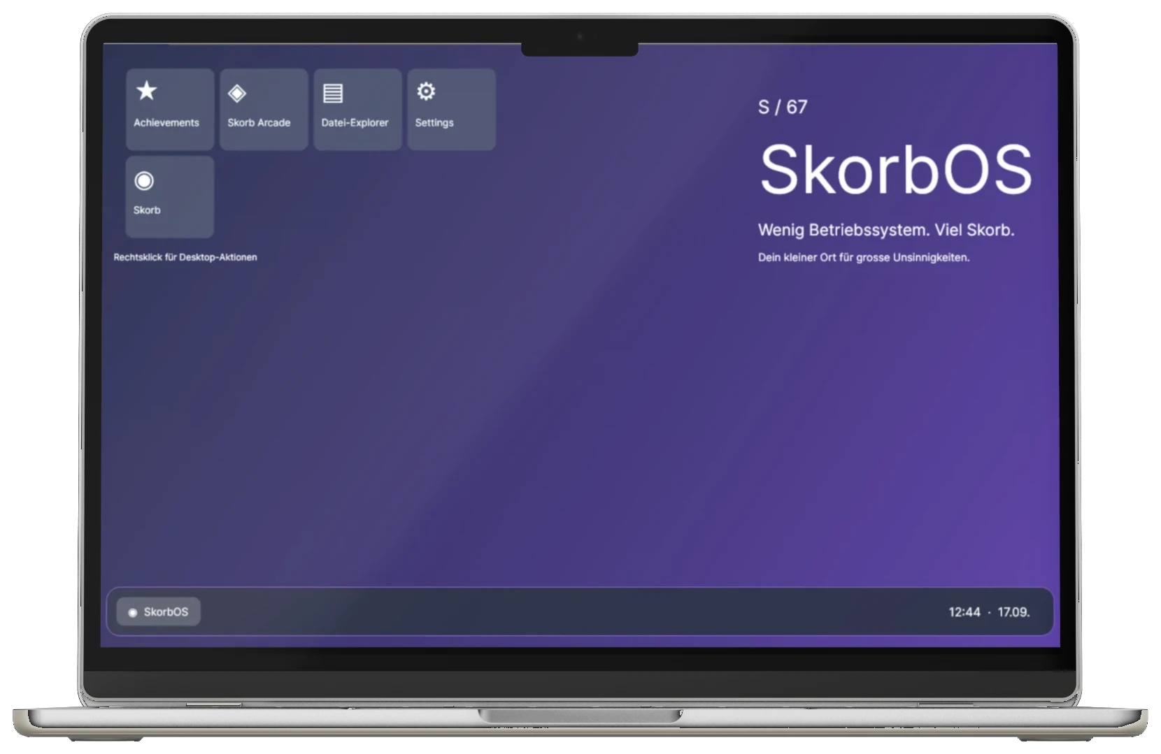 A laptop seen straight on showing the Skorb OS desktop with app tiles in the top left and the SkorbOS wordmark on a violet gradient